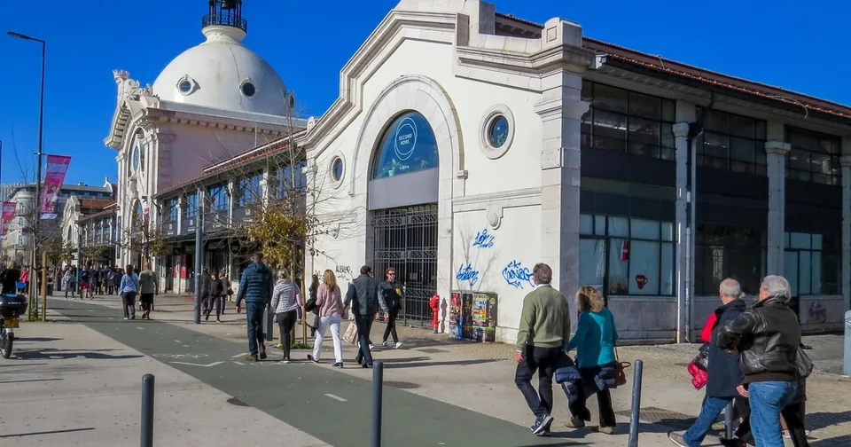 The facade of a covered market hall in Lisbon